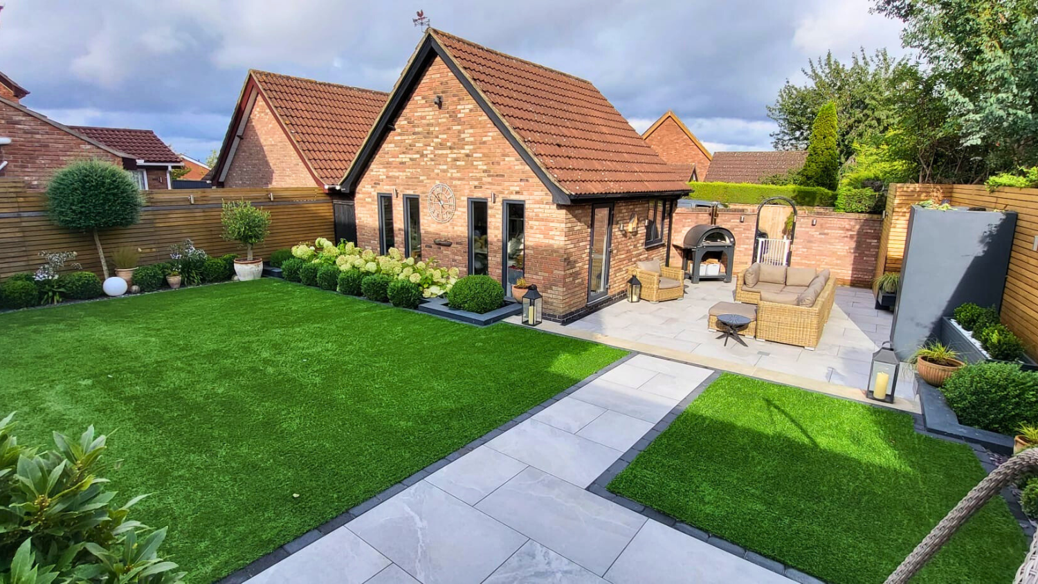 Sue and John's garden - view across the artificial lawn and porcelain patio